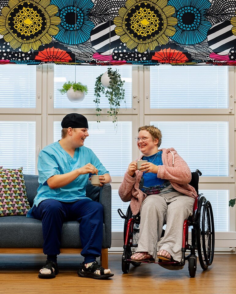 Two people drinking coffee and having a conversation